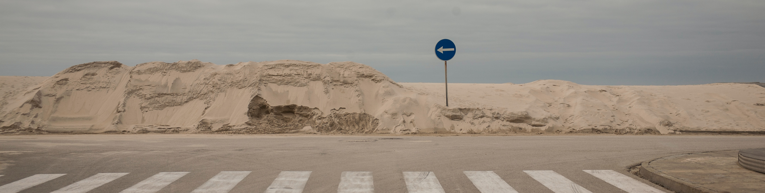 Photo of road with pedestrian lane. Photo by Kristaps Grundsteins on Unsplash